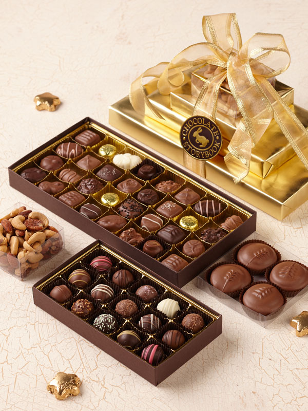 Gold executive tower junior filled with assorted chocolates, truffles and cookies.